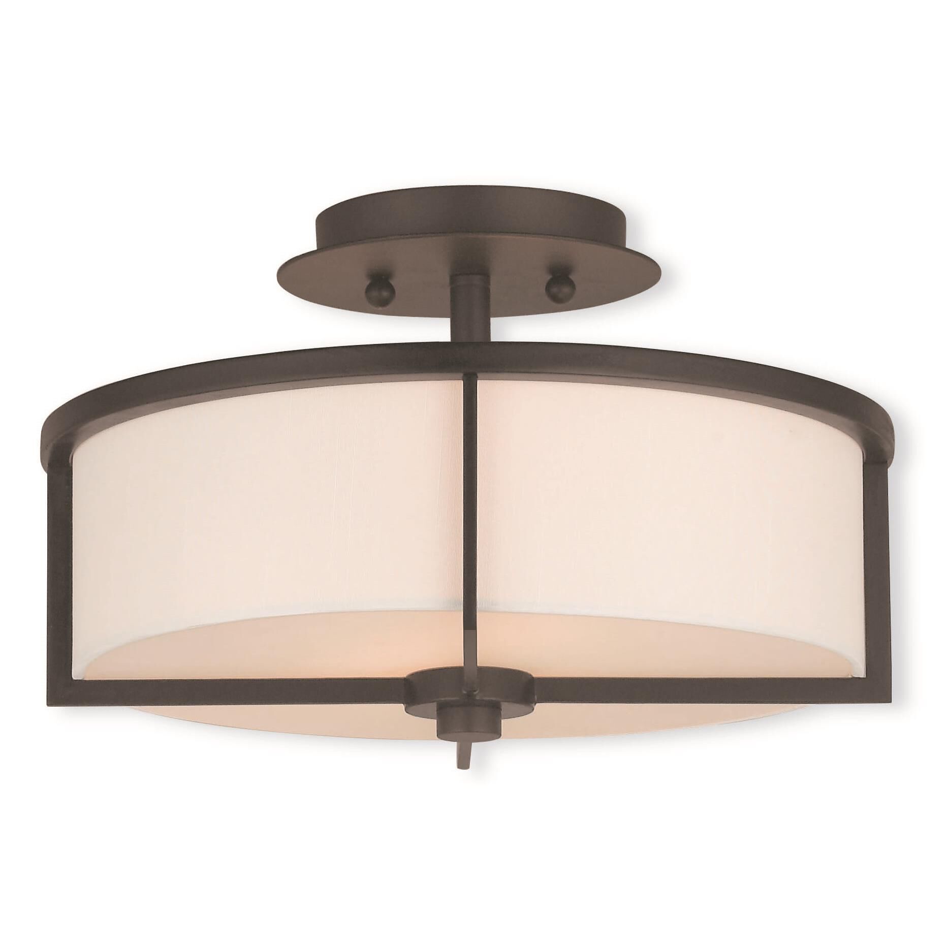 Shown in Bronze finish and Hand Crafted Off-White Fabric Hardback shade